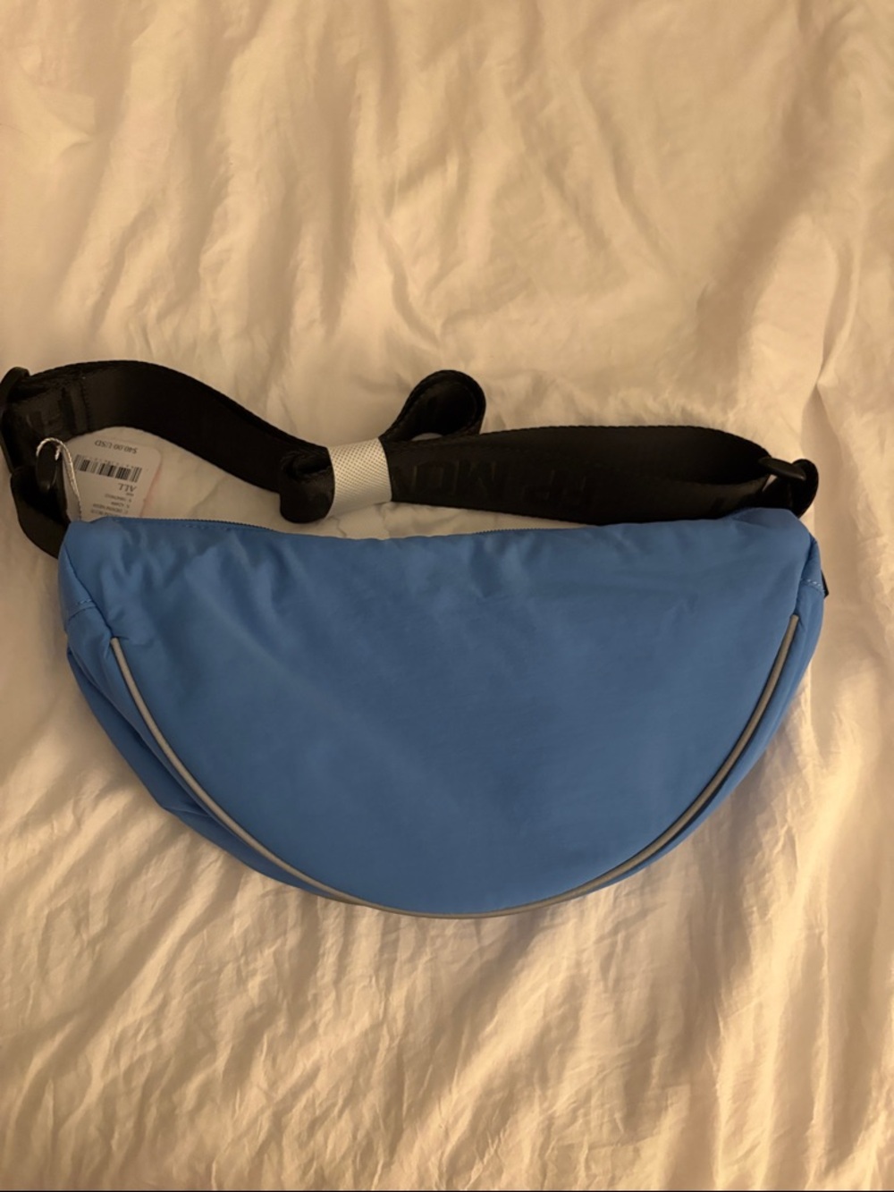 Light Blue Crescent Sling Bag with Black Strap.Free People